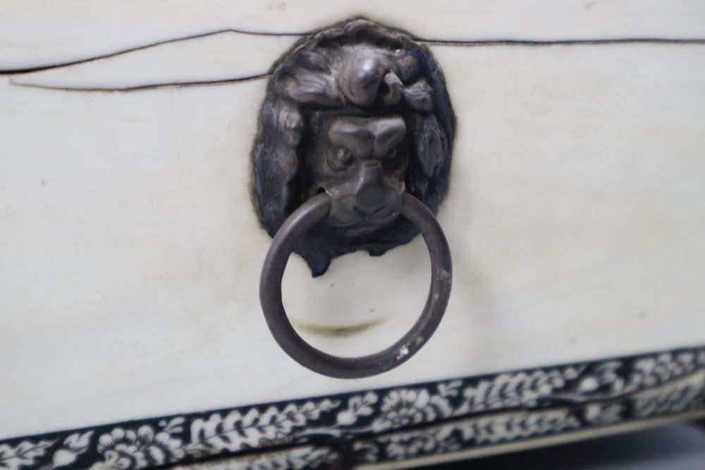 An early 19th century Anglo-Indian Vizagapatam dressing table box, of sarcophagus form, with lion paw feet, width 27cm